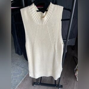 Pink Rose Cream Knit Sleeveless Sweater could be worn as a dress.